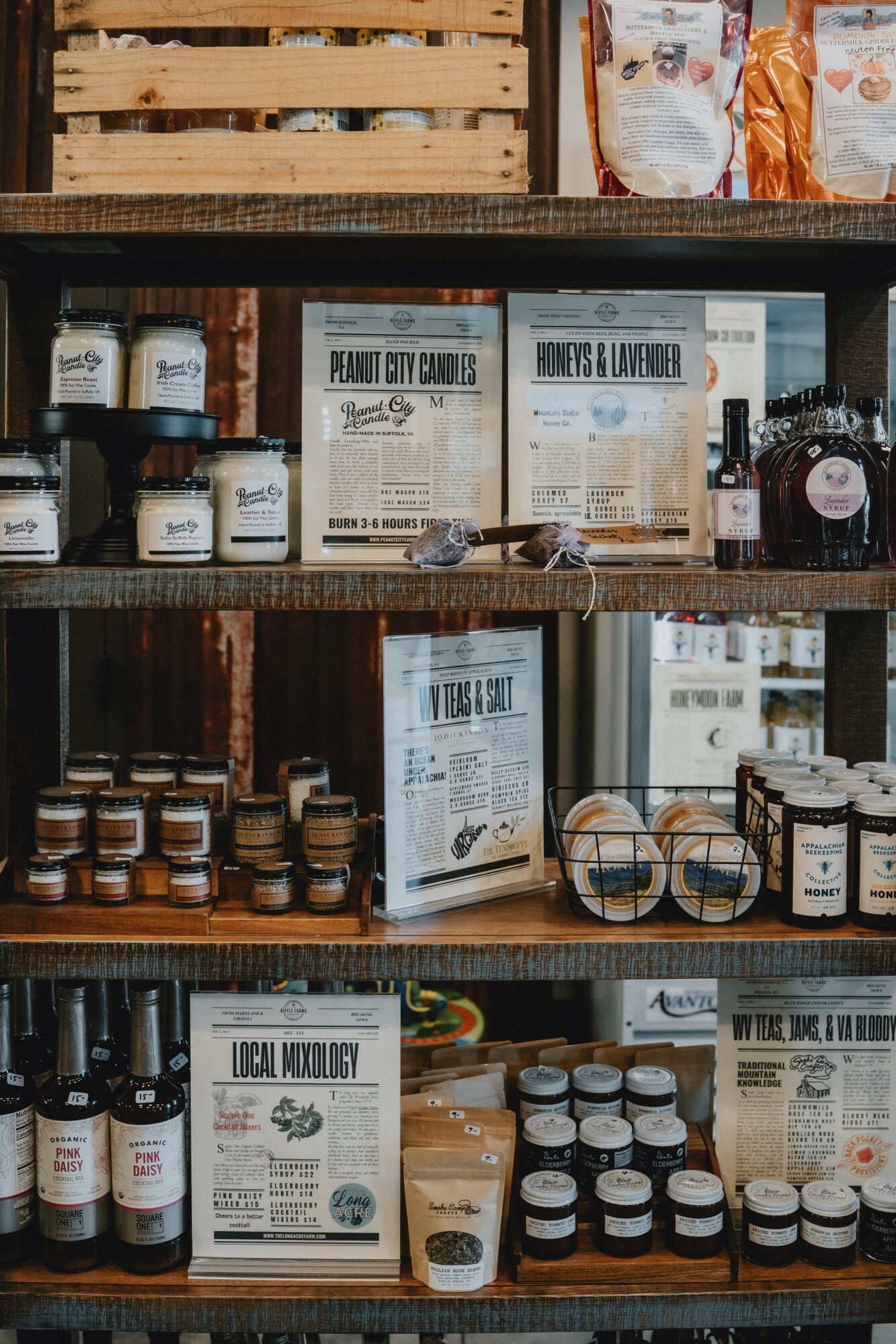 Shelves with jars, boxes, and informational signs in a store display, organized by product type.