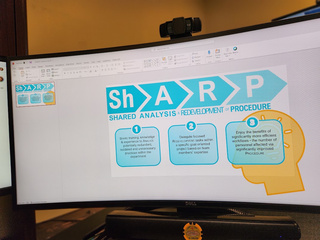 Computer screen displaying a shared analysis development procedure diagram with arrows and text boxes.