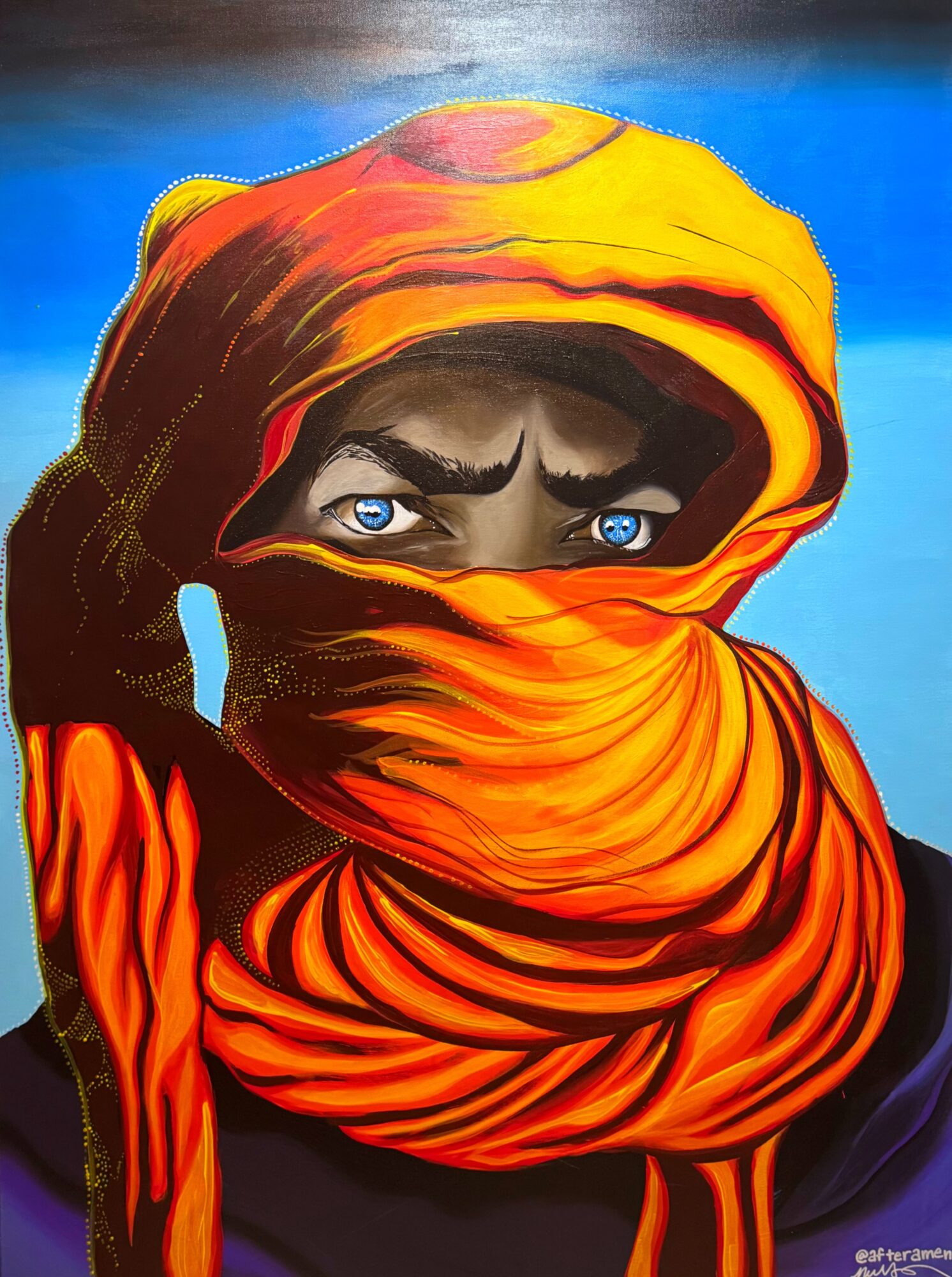 Person with intense blue eyes and dark eyebrows, wearing a bright orange headscarf covering most of face, against a blue background.