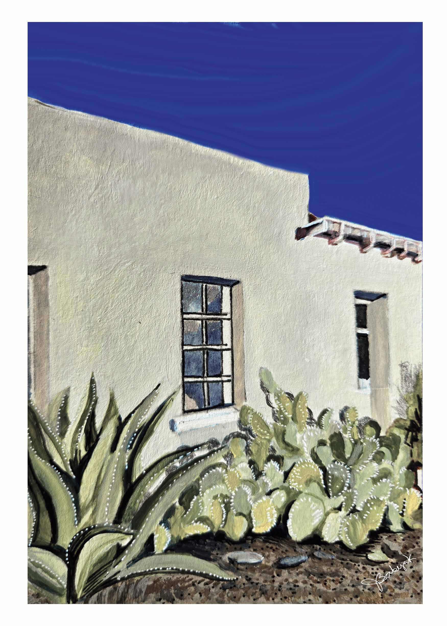 White building with windows, cactus plants in front, blue sky above, and part of a tiled roof visible.