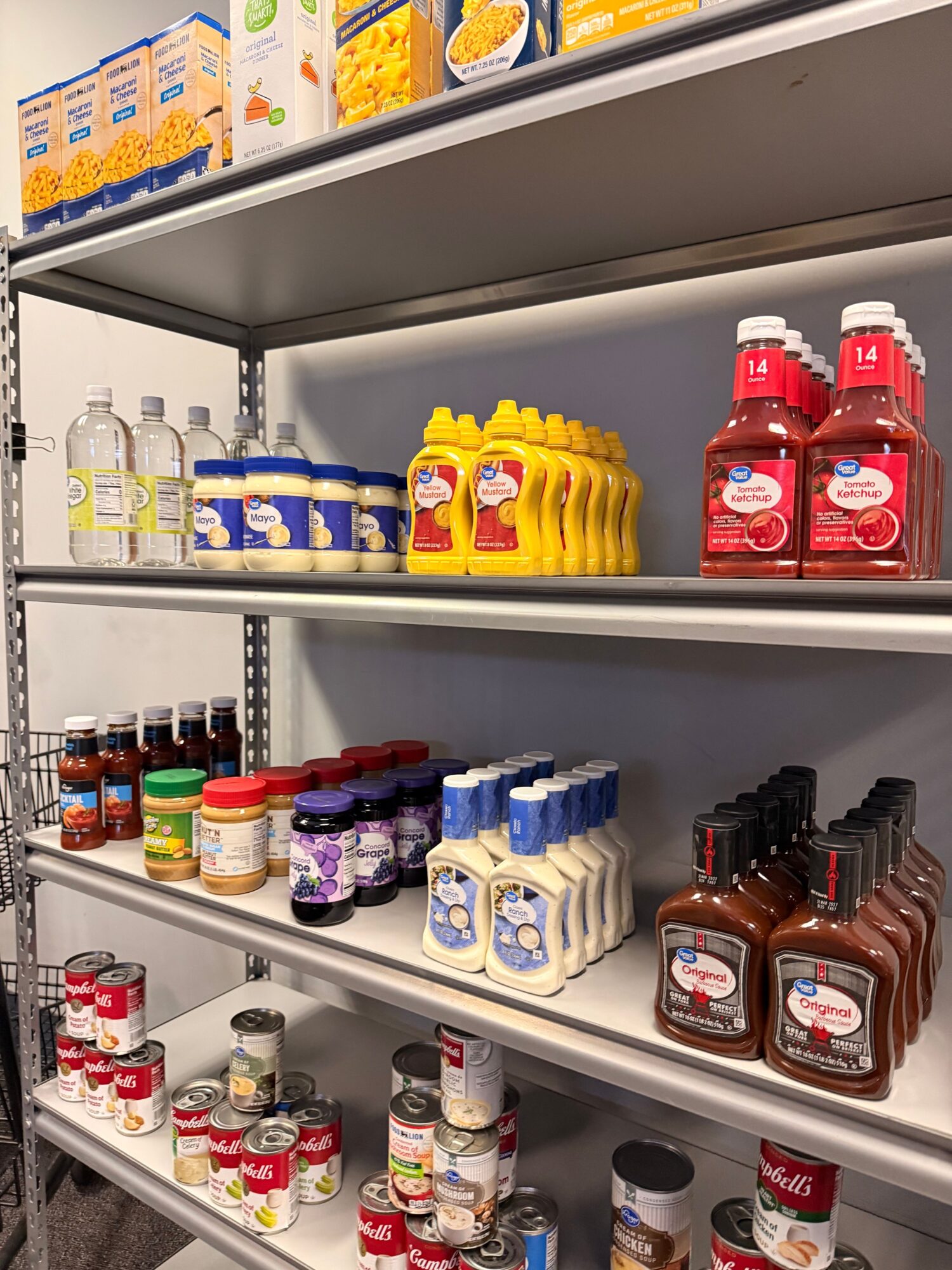 Shelves stocked with various bottles and containers, including red, yellow, blue, white, purple, and brown bottles.