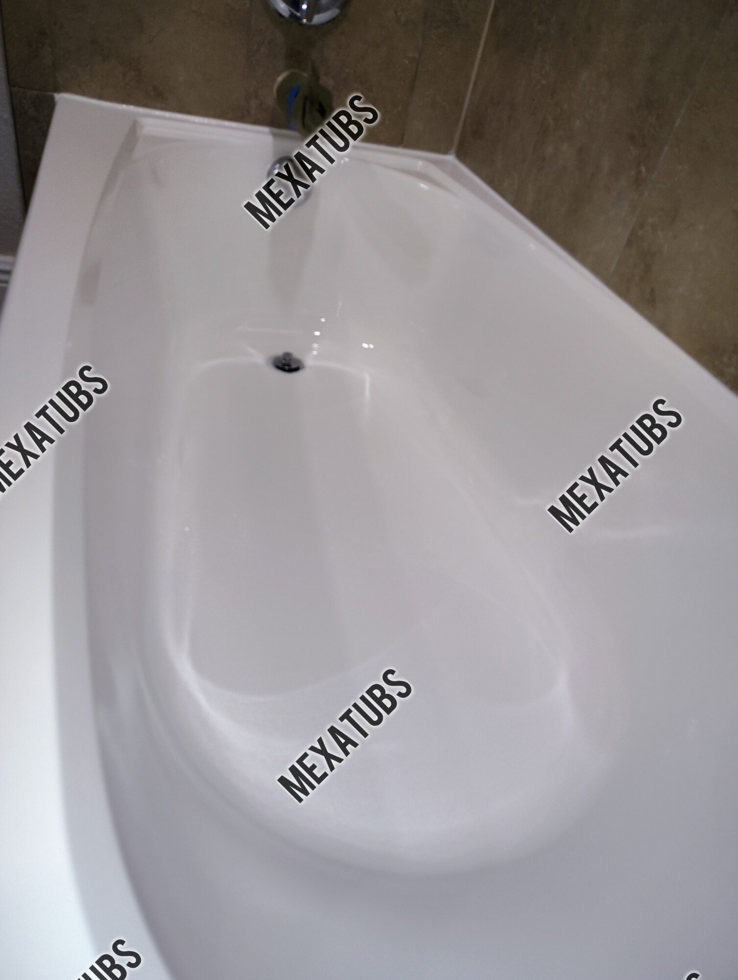 White bathtub with a drain and faucet, surrounded by brown tiled walls.