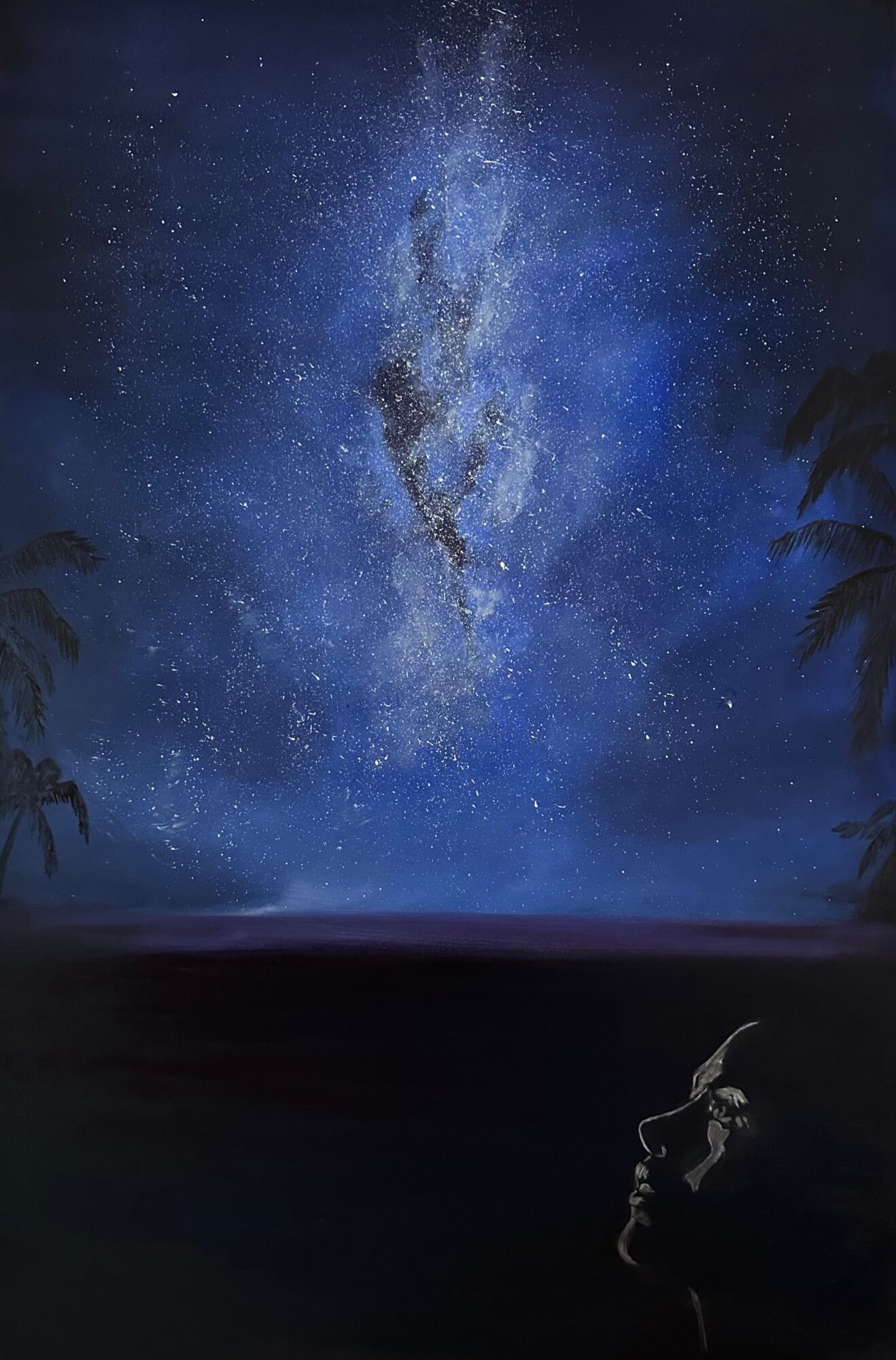Night sky filled with stars and the Milky Way galaxy, with silhouettes of trees and a person looking up.