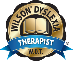A circular badge with a gold border, an open book icon, and a blue ribbon with the word 'THERAPIST'.