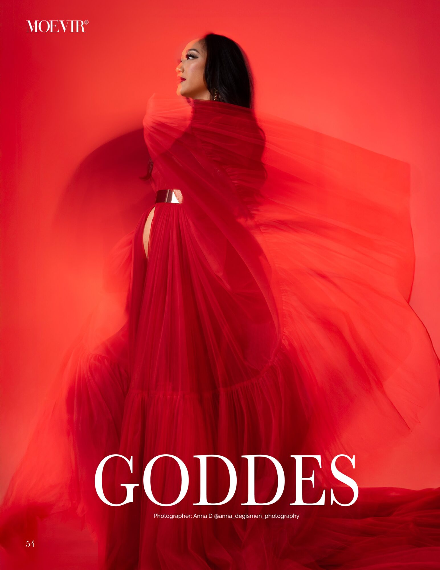 Woman in flowing red dress looking upward against red background, with the word 'GODDES' in white at bottom.