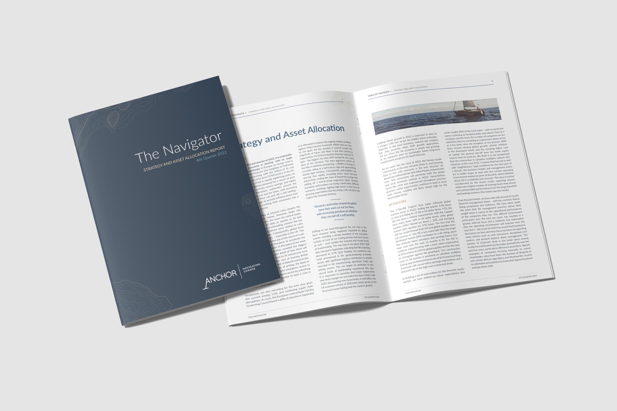 Open magazine with a dark blue cover titled 'The Navigator' and visible pages with text and images.
