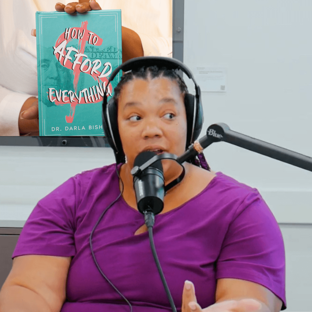 Woman wearing purple shirt speaking into microphone with headphones, background shows a book titled 'How to Afford Everything'.