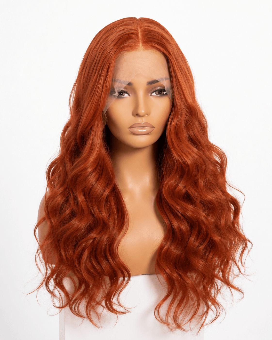 Woman with long, wavy red hair and neutral expression, facing forward against a white background.