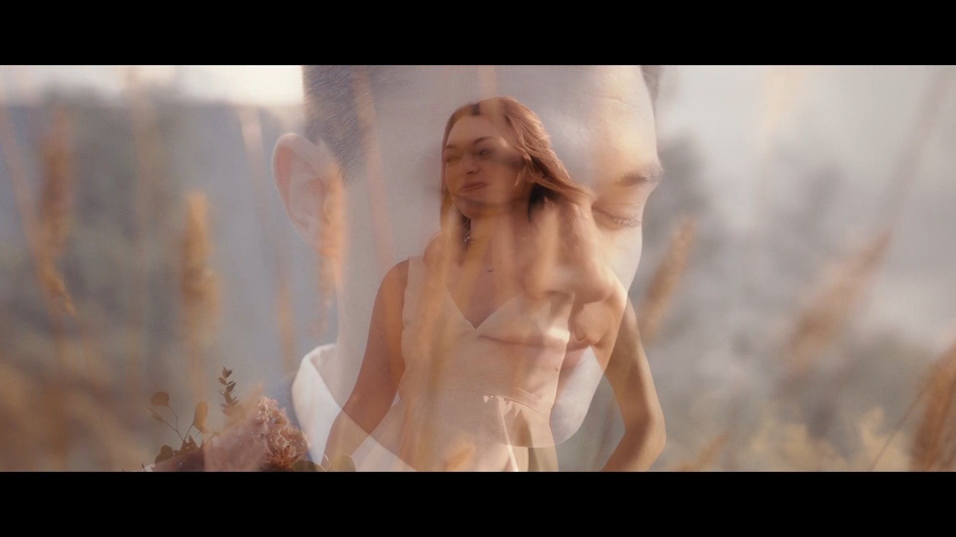 Double exposure of a woman with closed eyes and a landscape background, blending her face with nature elements.