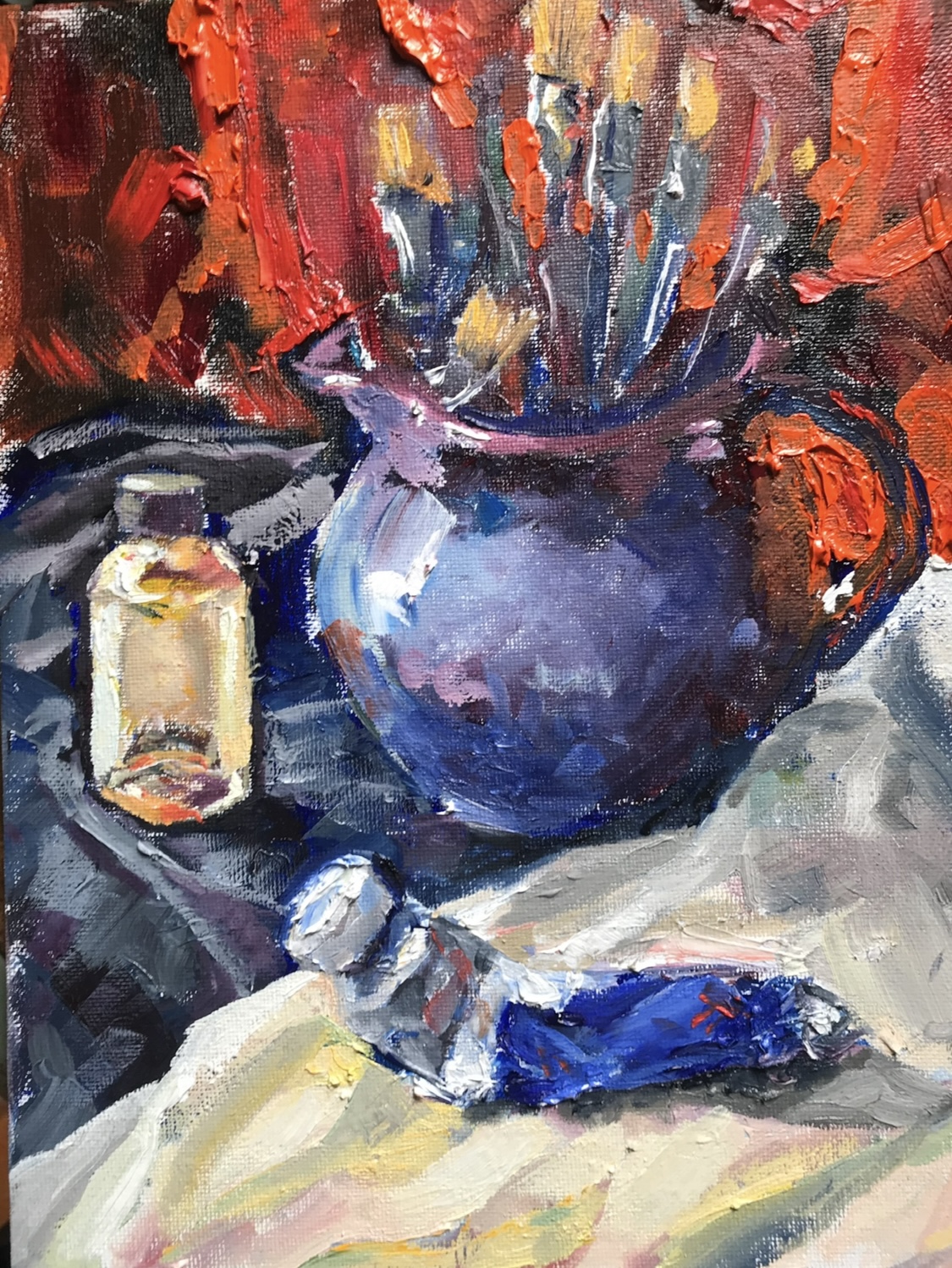 A still life painting of a blue vase with flowers, a candle, and a cloth, using bold brushstrokes and vibrant colors.