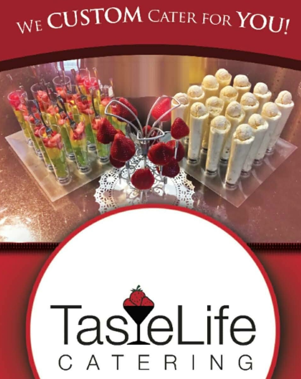 Display of colorful and white dessert cups with a logo for TasteLife Catering, featuring a martini glass with a strawberry, on a table.