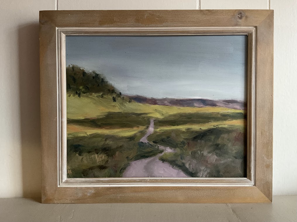 Landscape painting of a winding path through green fields with hills and trees in the background.