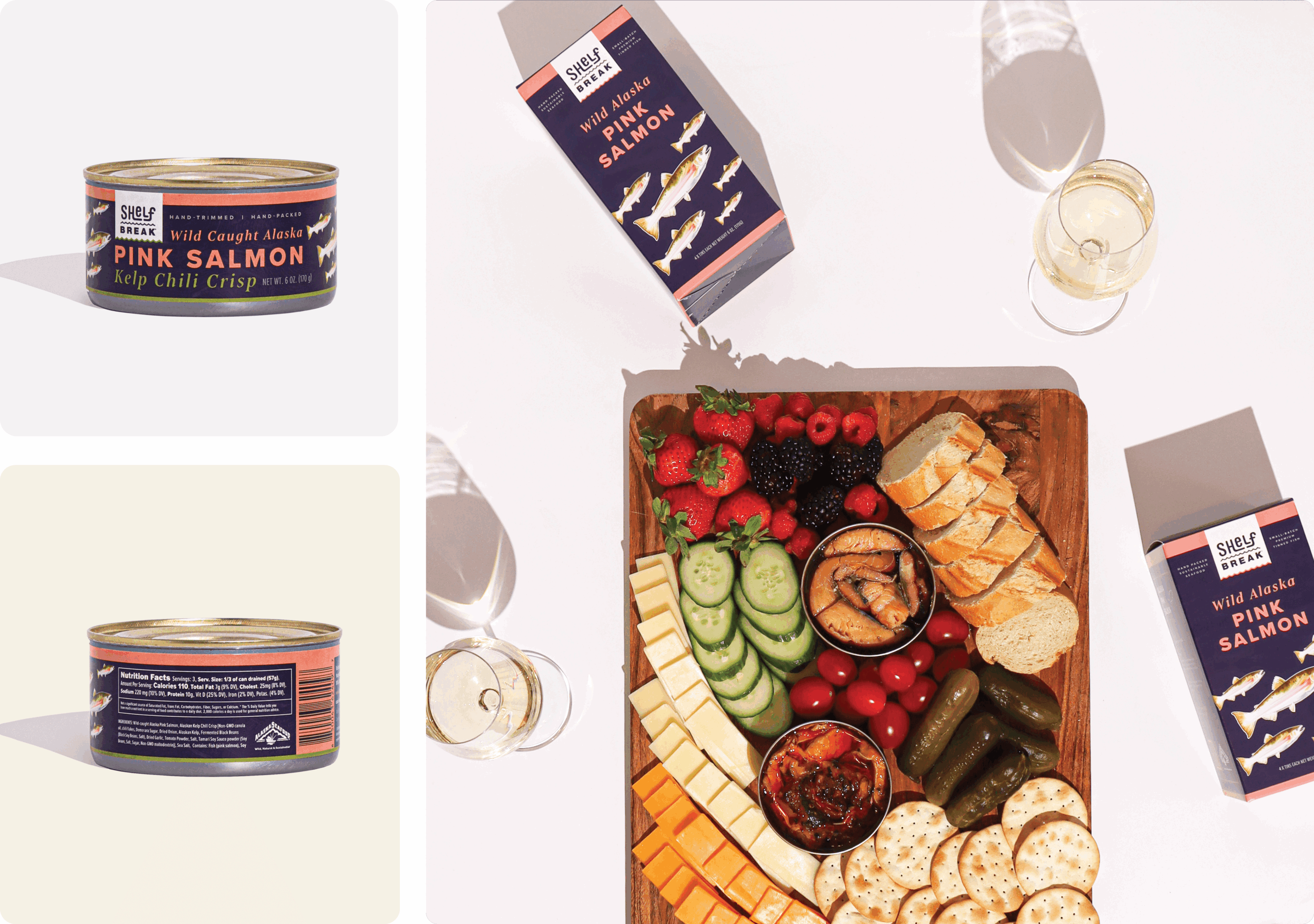Assorted food and drinks on a table, including canned salmon, a cheese platter with vegetables, wine glasses, and a carton of pink salmon.