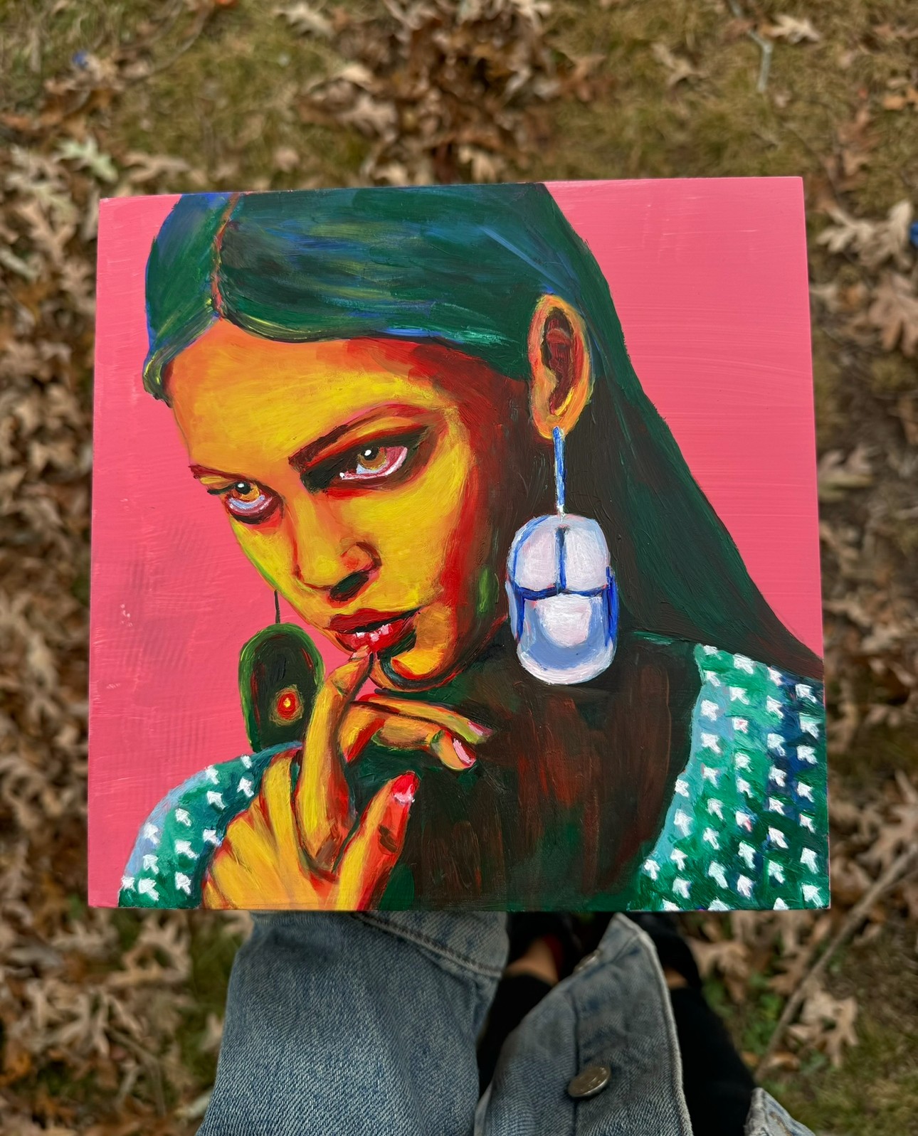 Portrait of a woman with green hair, yellow face, and large earrings, holding a small green object near her lips.