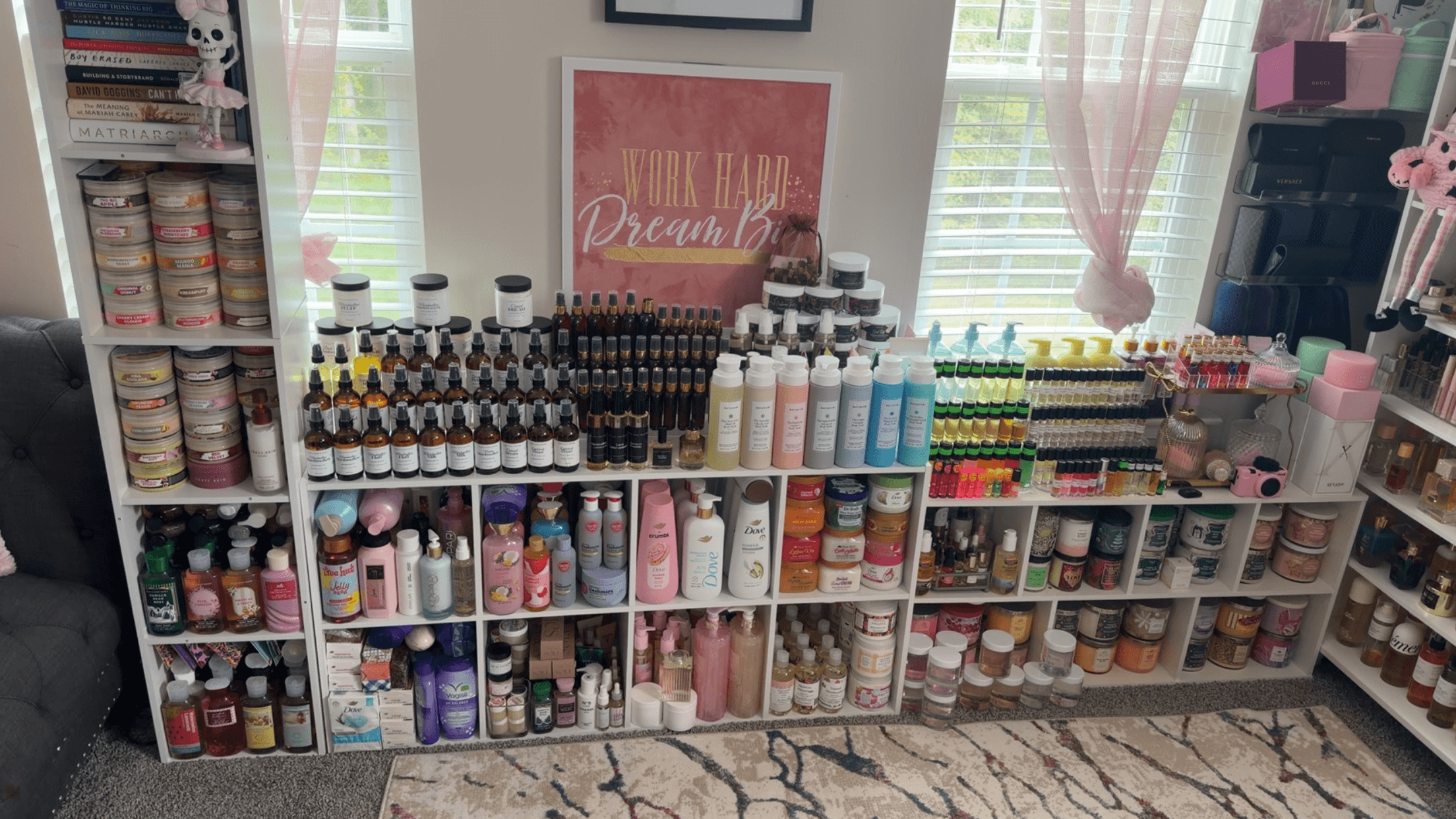 Display of various bottles, jars, and containers on shelves in a store, with a pink sign and windows in the background.