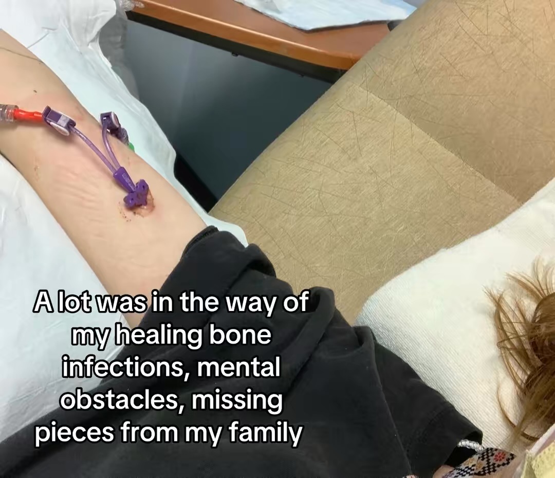 Person's arm with IV line, lying on a bed, with text about healing bone infections and missing pieces from family.
