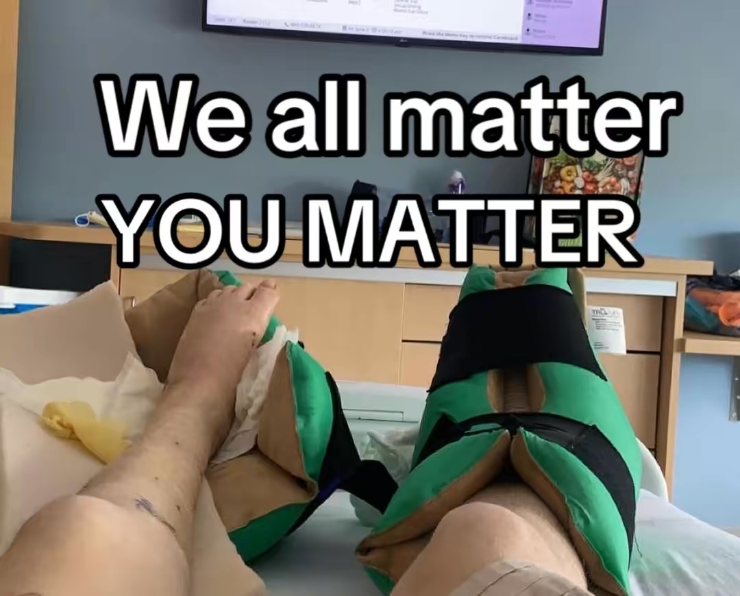 Person holding hands with a dog on a bed, with text saying 'We all matter, you matter'.