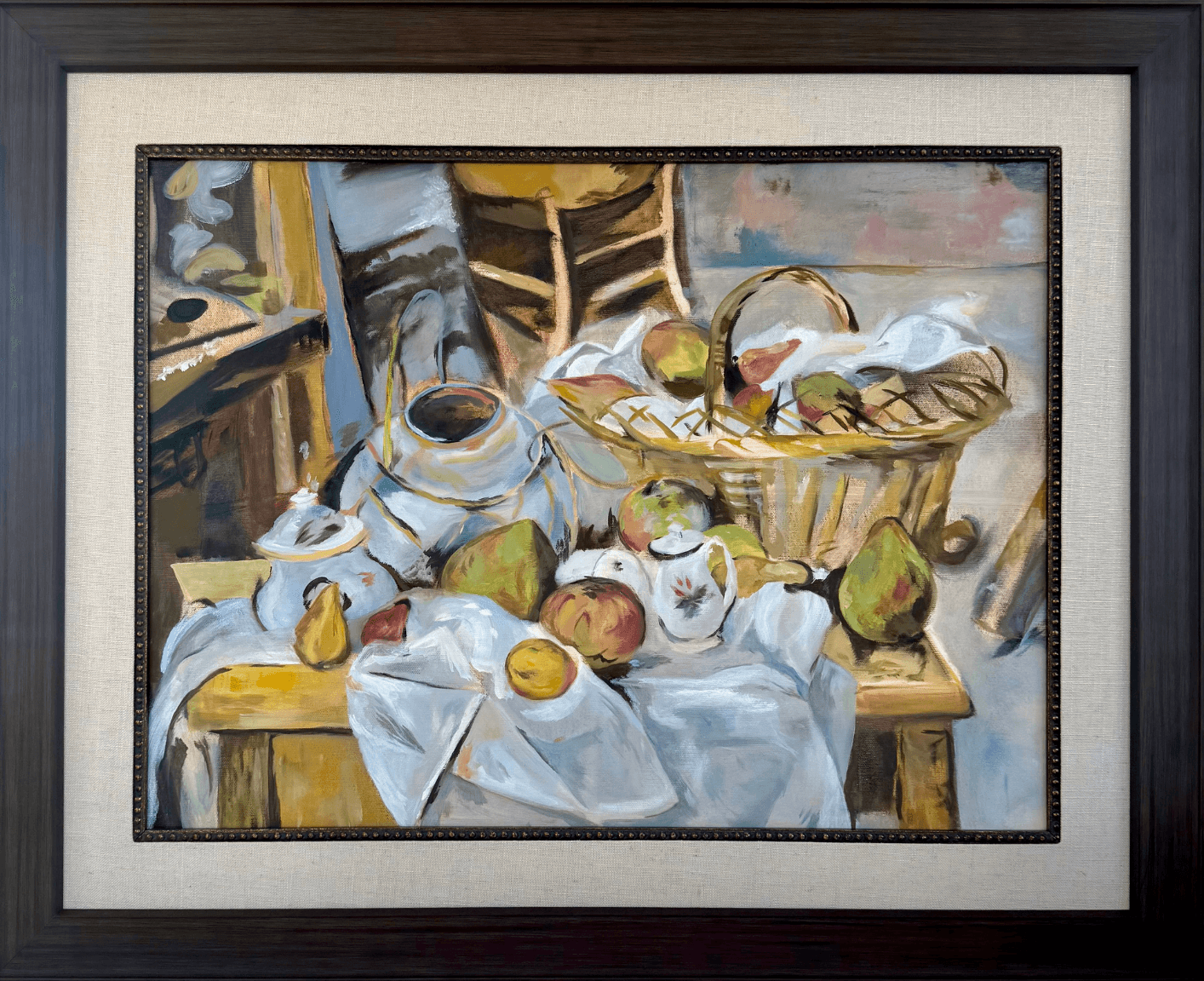 Still life painting of fruit, a basket, and cloth on a table with chairs in background.
