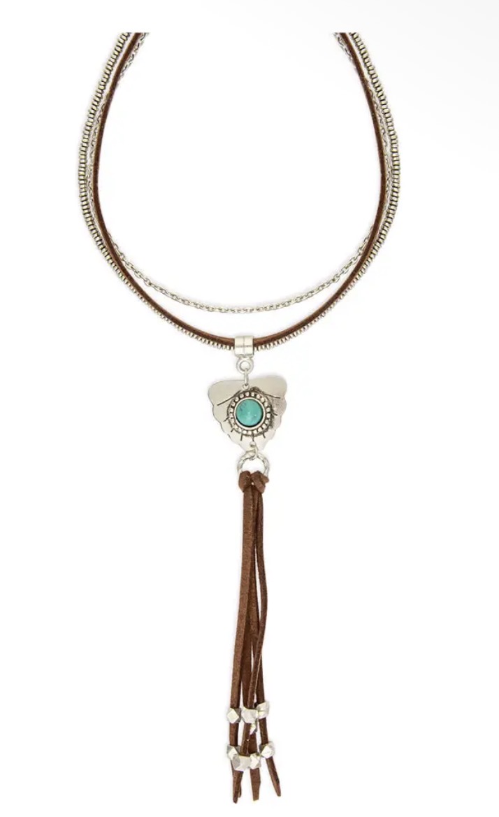 A necklace with a double-strand metal chain, turquoise pendant, and long brown cord tassel.
