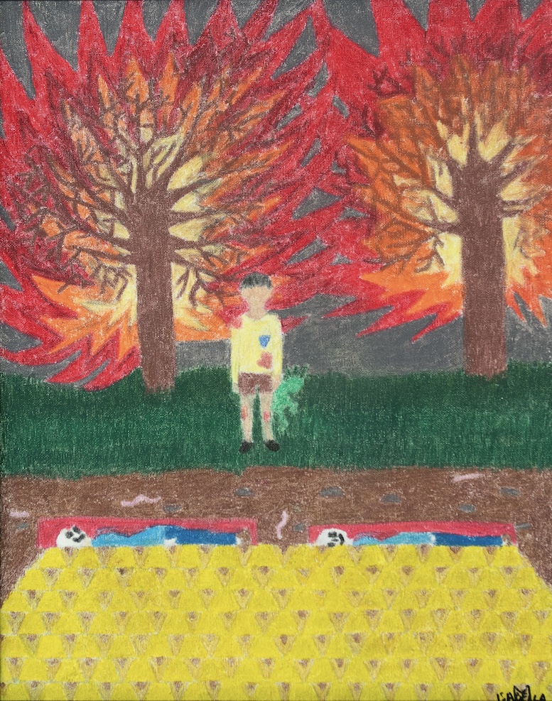 Child standing between two trees with colorful autumn leaves, grass, and a yellow patterned blanket with soccer balls, holding a plant.