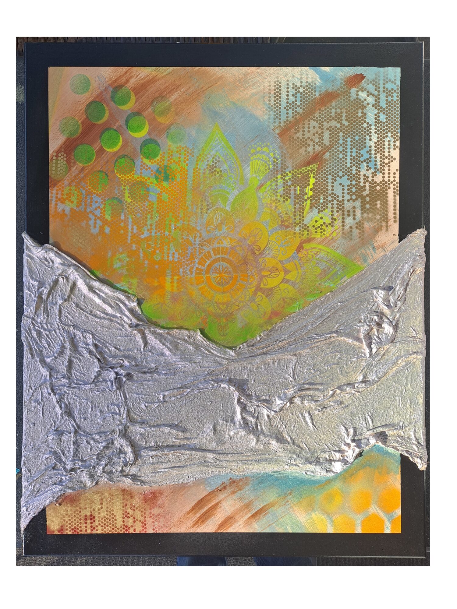 Abstract artwork with colorful patterns and textured silver elements in a black frame.