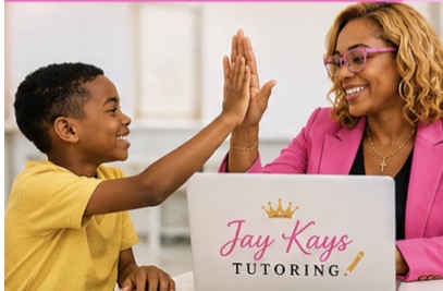 A young girl and woman high-five, smiling, with a laptop displaying 'Jay Kays Tutoring' in front of them.