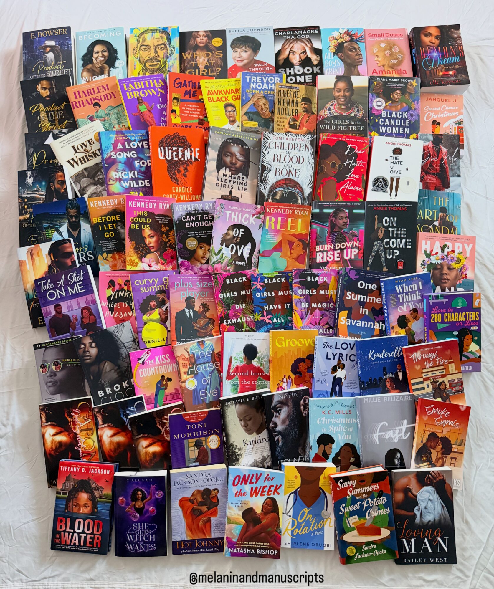 A large collection of colorful book covers arranged in rows on a light surface.